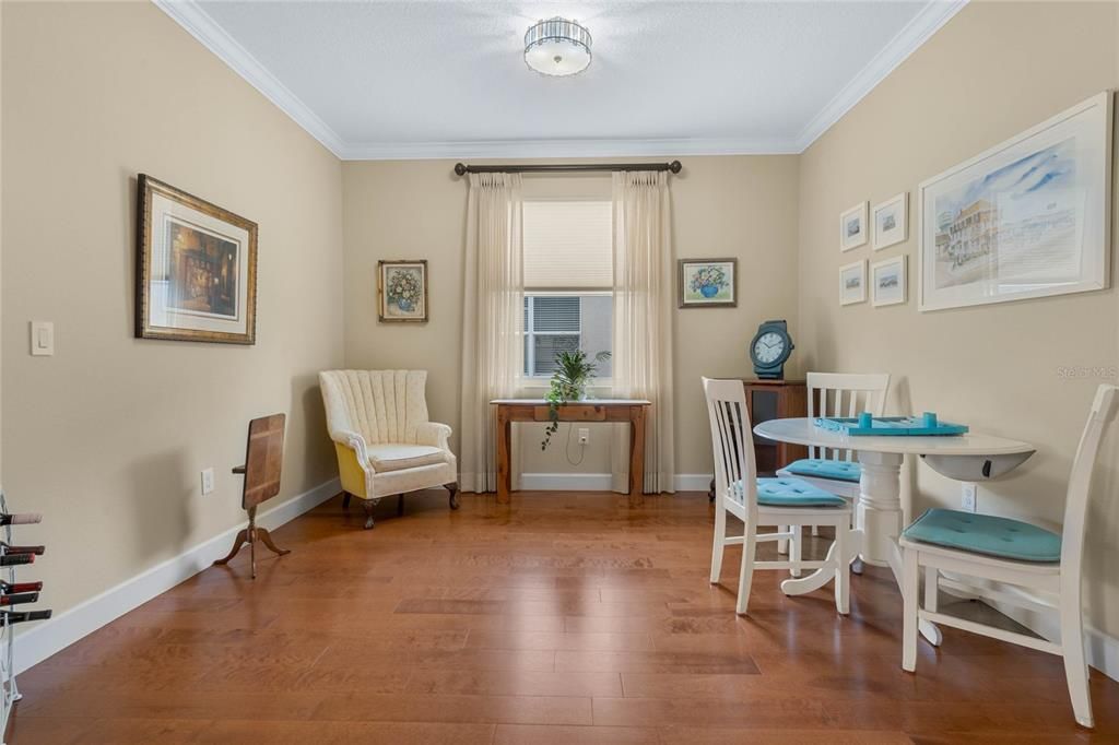 Formal Dining Room features Wood Flooring and Crown Molding