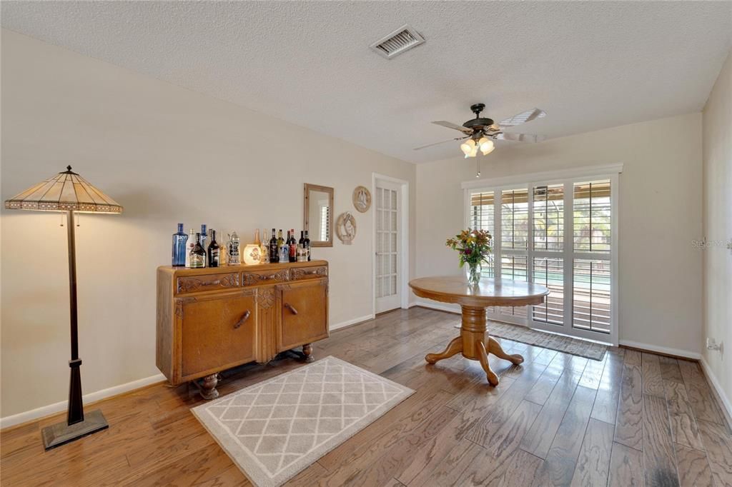 FORMAL DINING ROOM WITH SLIDER TO LANAI AND ENTRY DOOR TO MASTER BEDROOM