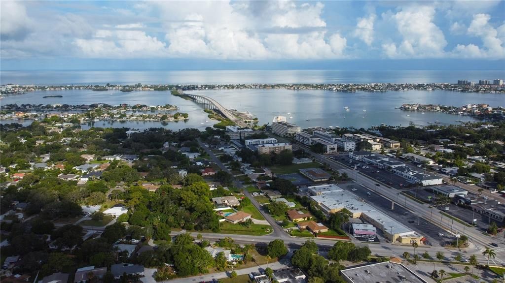 Aerial view of nearby bridges across the intercoastal and looking west towards the gulf