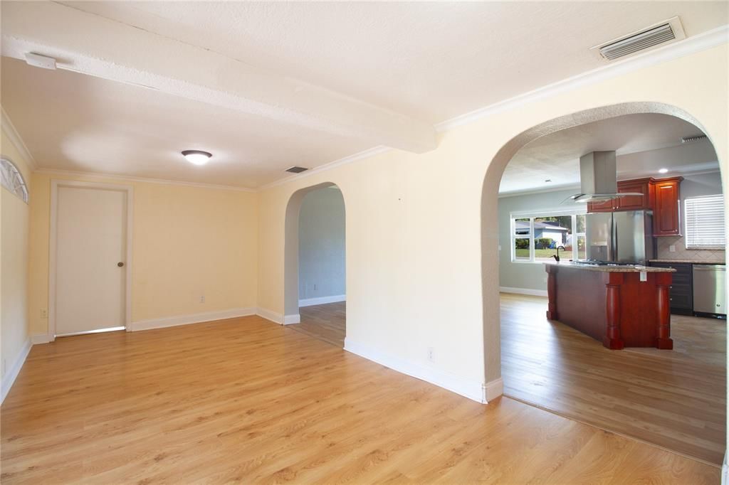 Living or dining room back toward open space and kitchen