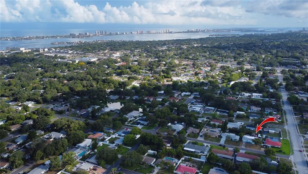 Aerial view of home in neighborhood looking northwest to the gulf