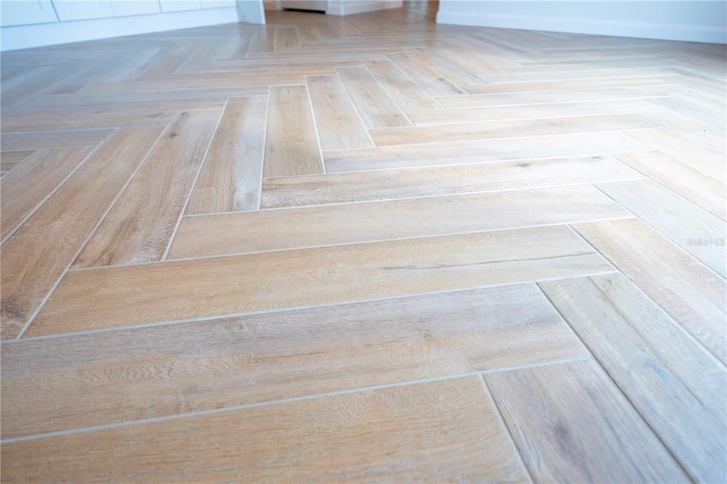 This herringbone wood-look tile is throughout the home