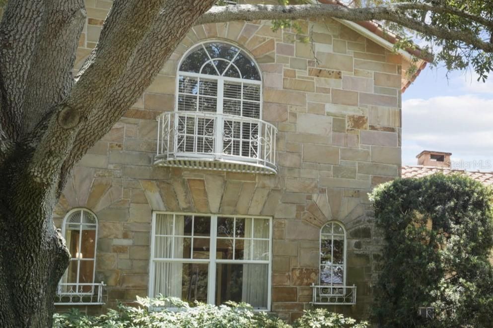 Arched Windows and Coin Balconies