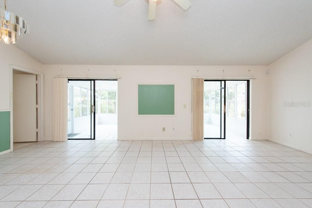 2 sliding glass doors to the enclosed sunroom