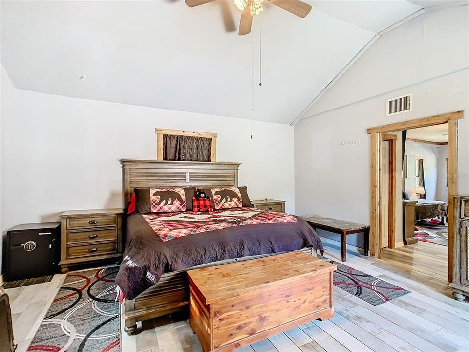 Primary bedroom is 15' x 16' with porcelain plank flooring throughout the suite.