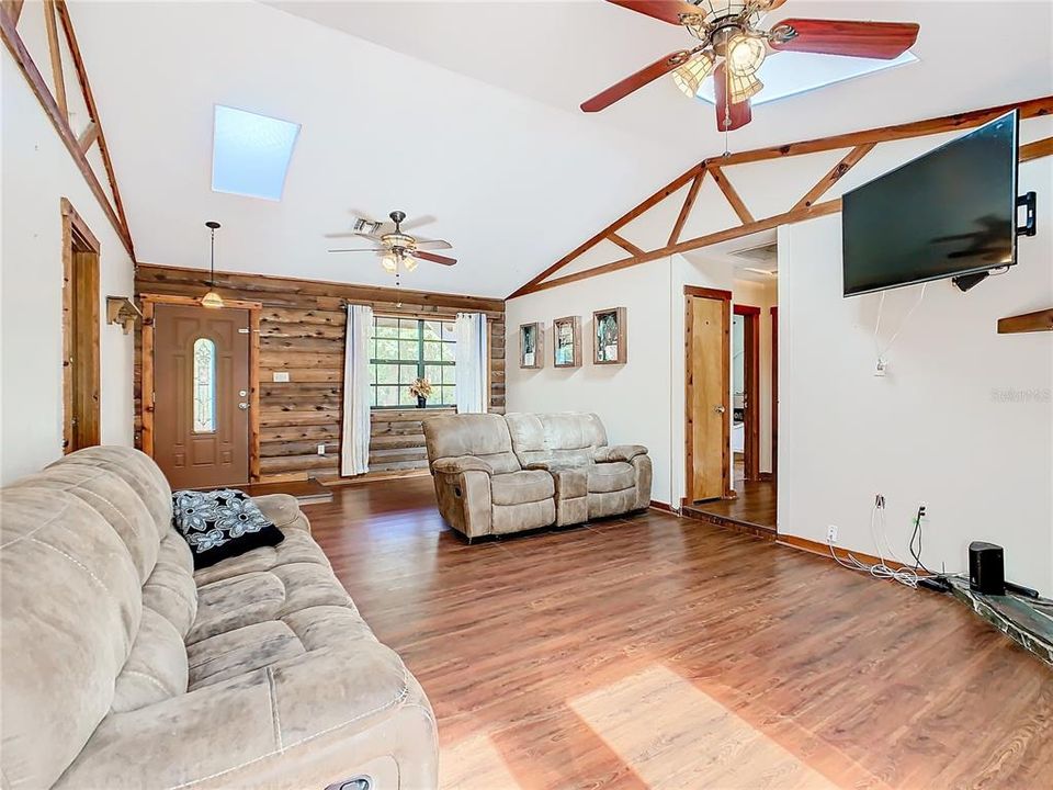 Living room has cathedral ceiling