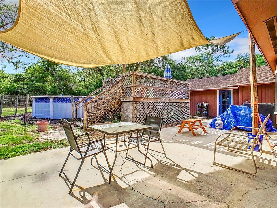 Private back yard with pool and patio area.