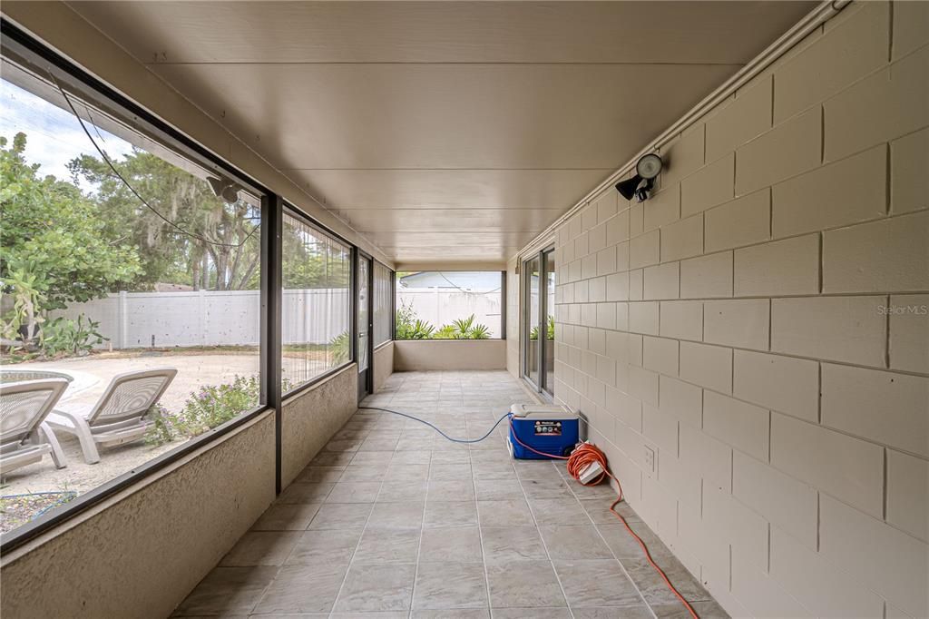 33' x 7' Screened Lanai overlooking the backyard and pool