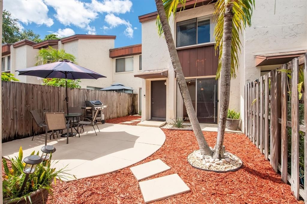 Home front with gated courtyard and garage entrance