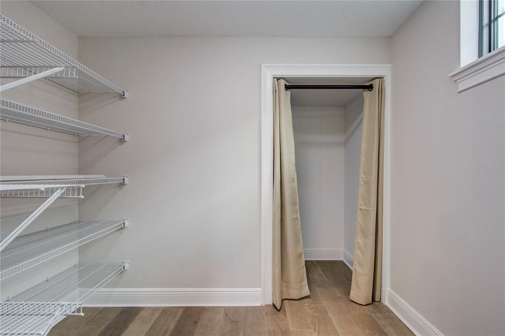 Pantry with extra storage under the stair case