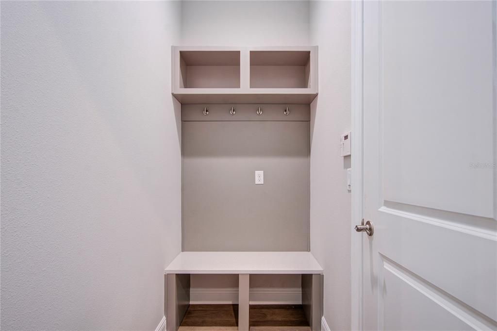 coat/shoe rack area near garage entrance