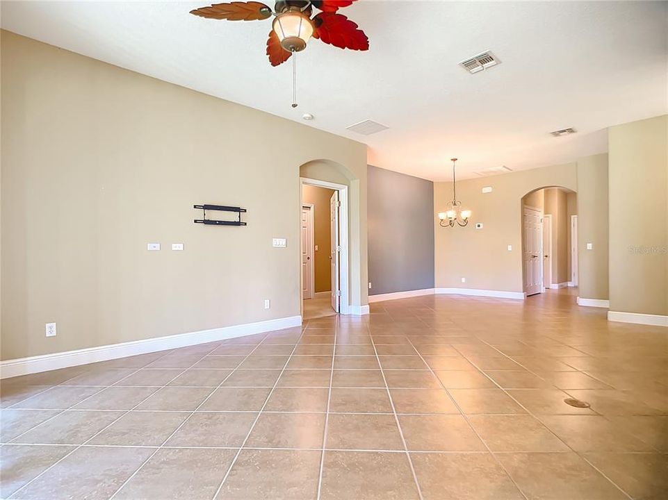 Living room and dining room while standing in the eat in area of the kitchen