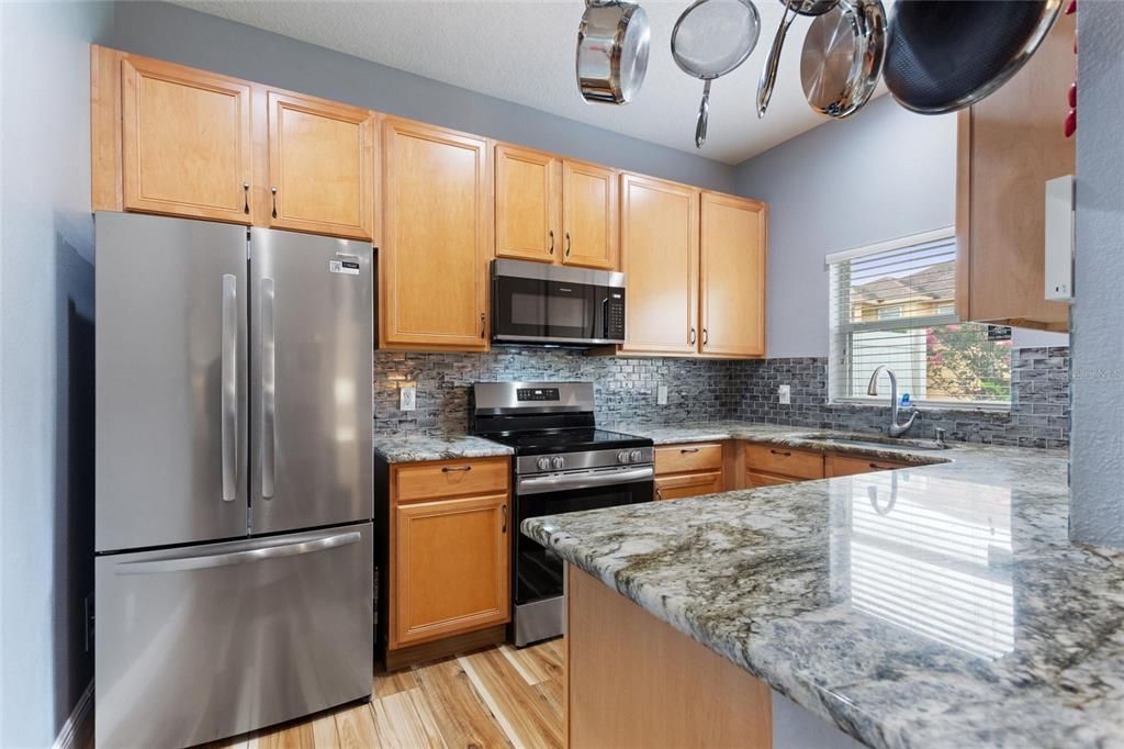 Granit countertops, backsplash, and a new stainless steel appliances.