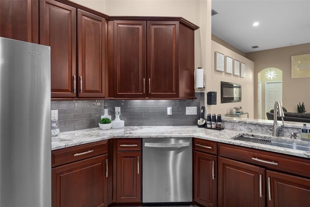 Kitchen with Granite Counters and Tile Backsplash