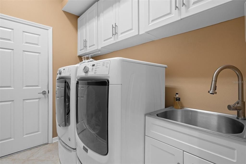 Laundry Room with Cabinets and Sink