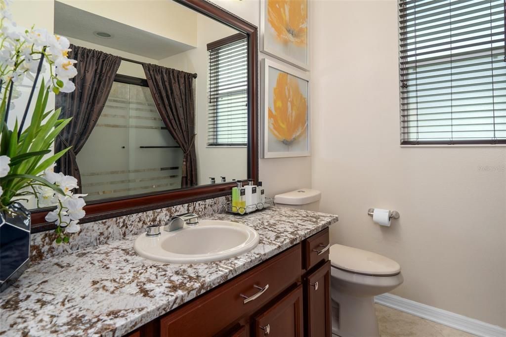 Guest Bath 2 with Granite Vanity and Tub with Glass Doors