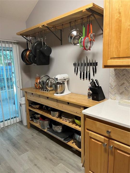 Will leave table w/storage shelves and cookware hanger if desired