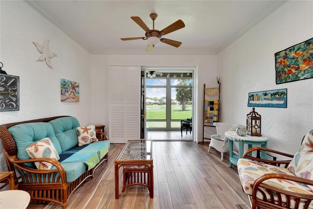 sitting area off the living space, notice the plantation sliding doors