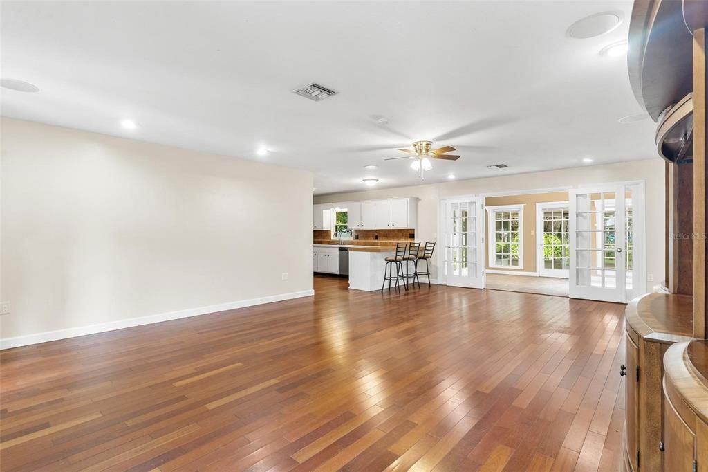 Living, Dining, and Kitchen Area with Brazilian Cherry Hardwood Floors