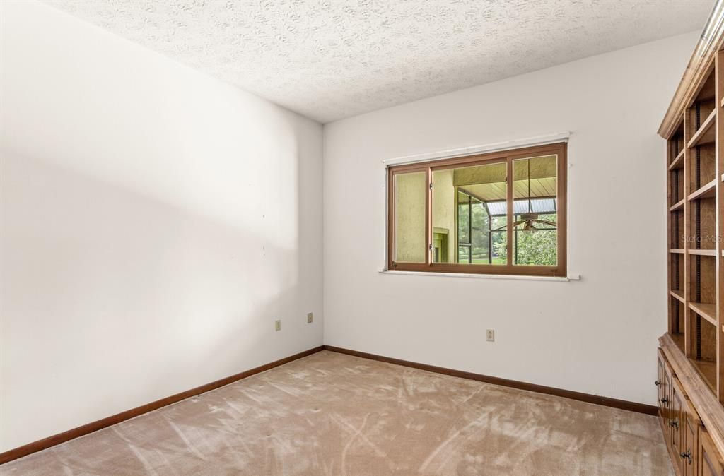 Fourth bedroom with built-in book cases!