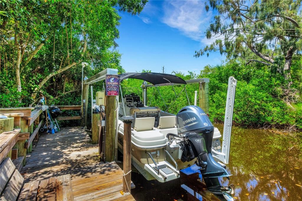 Boat on Lift with Canal Waterway.