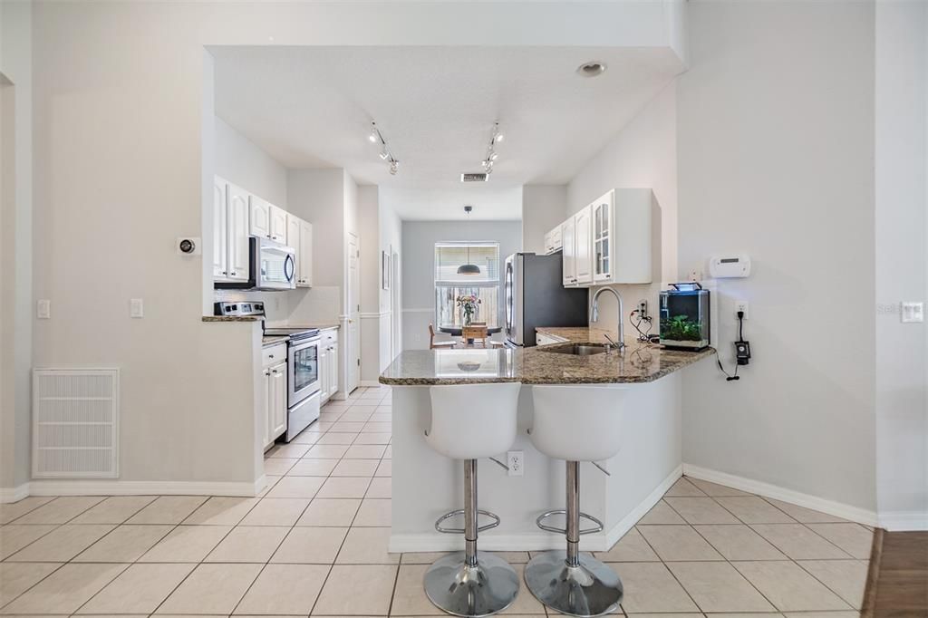 Open Kitchen to the Family Room, Granite countertop and Stainless Steel Appliances.