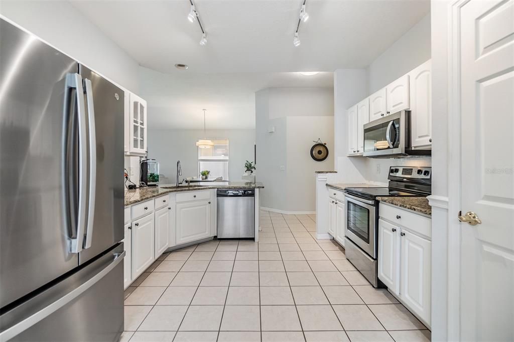 Open Kitchen to the Family Room, Granite countertop and Stainless Steel Appliances.