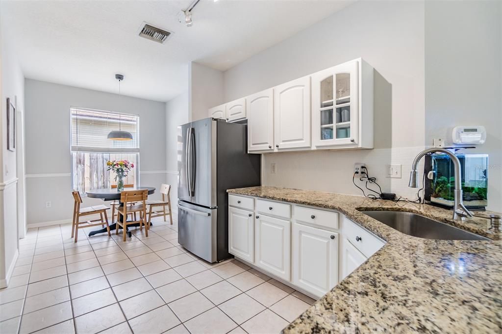 Open Kitchen to the Family Room, Granite countertop and Stainless Steel Appliances.