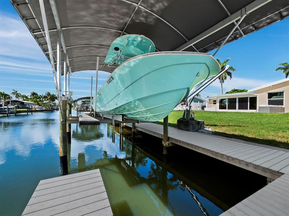 An L shaped dock makes everything very accessible and a covered 10,000 LB boat lift makes for a nice home for your boat!