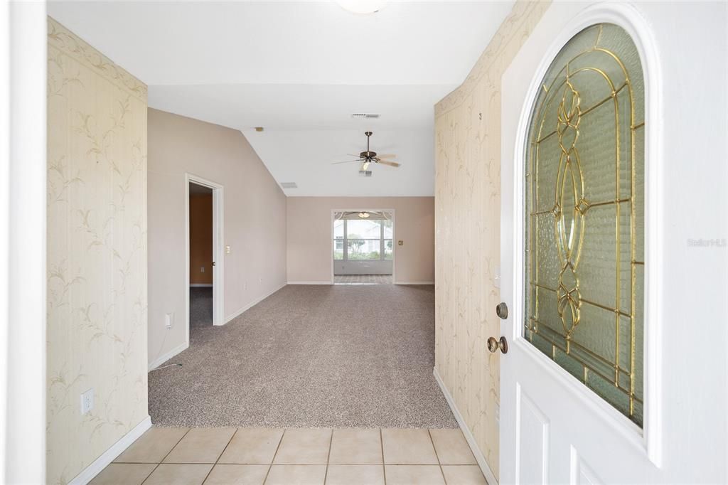 Spacious foyer welcomes you into the large living room.
