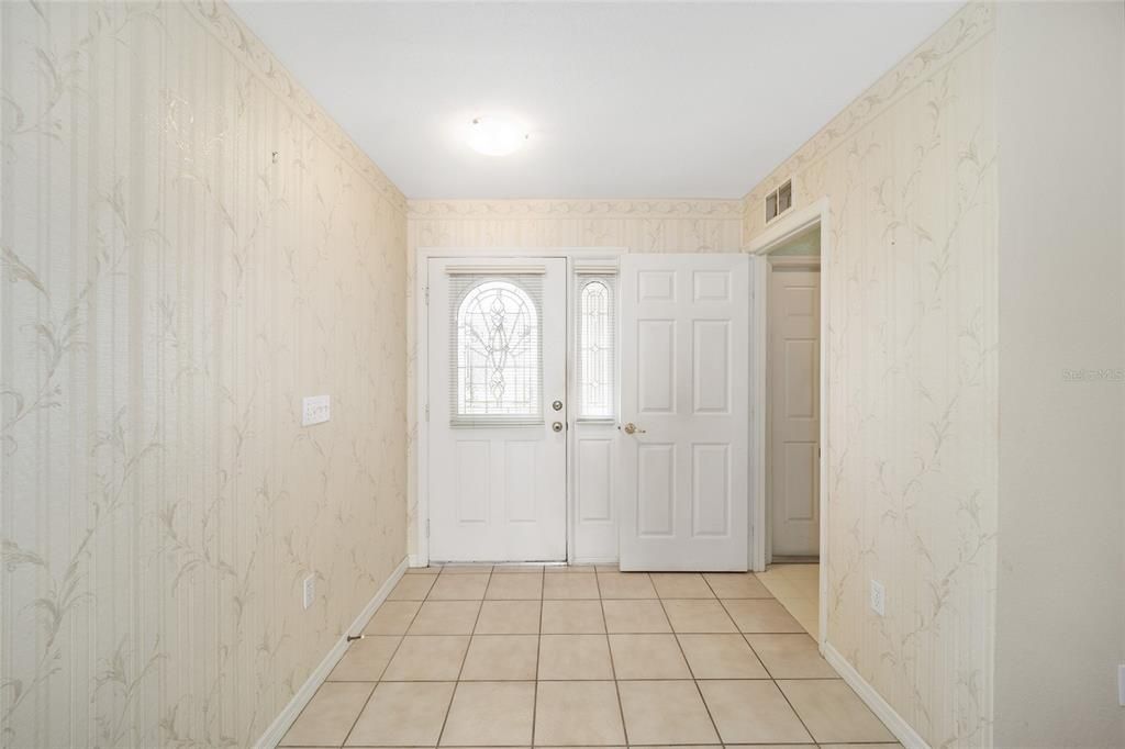 Looking back at entry foyer. Door to Laundry.