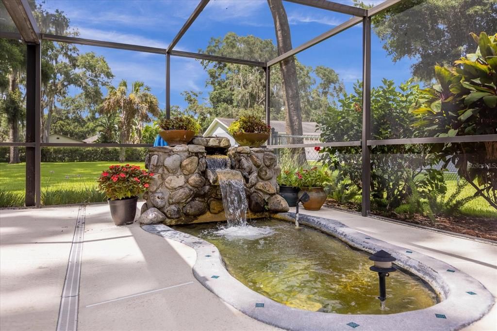 Koi pond with waterfall feature is separate filter pump