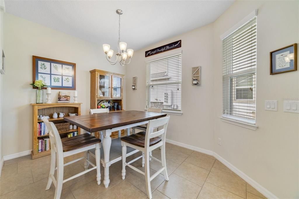 There are comfortable living and dining areas on either side of the kitchen and a convenient half bath.