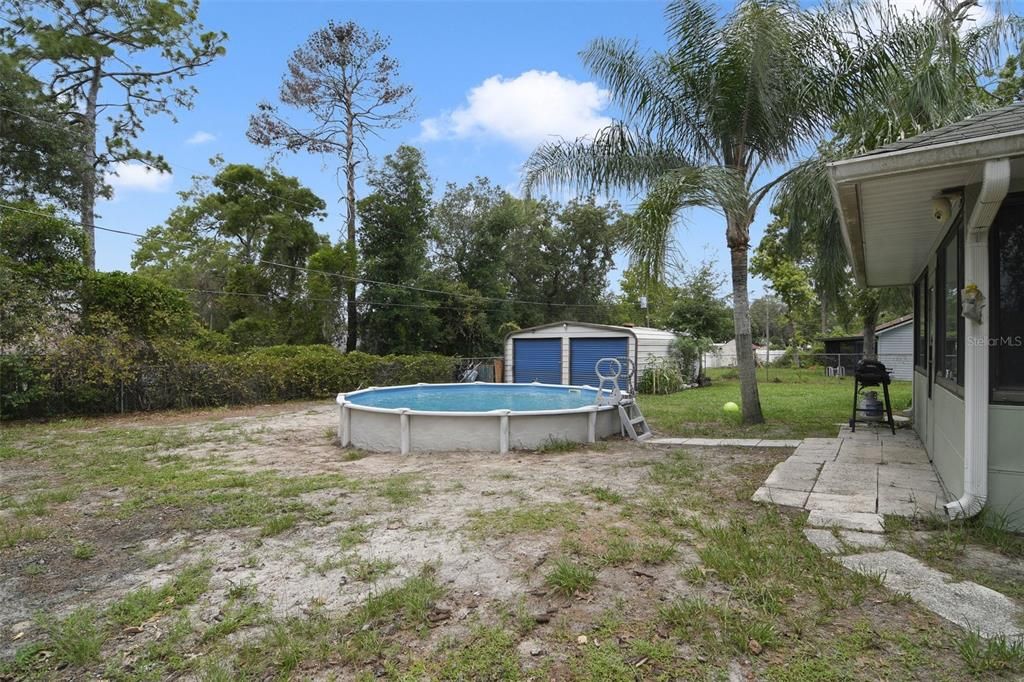 The expansive backyard is fully fenced and features an above ground pool for keeping cool in the Summer and a large shed for additional storage.