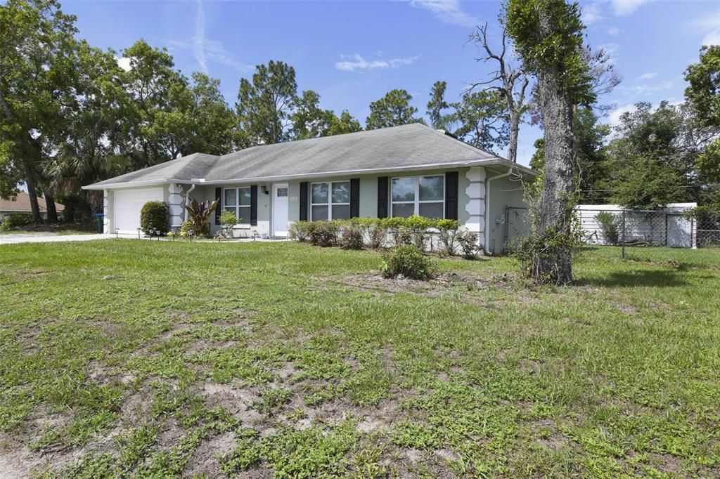 In the market for a first home or ideal investment property? Welcome to Deltona Lakes and this 3BD/2BA floor plan with an UPDATED KITCHEN/BATHROOMS, large fenced yard, .38 CORNER LOT and NO HOA!