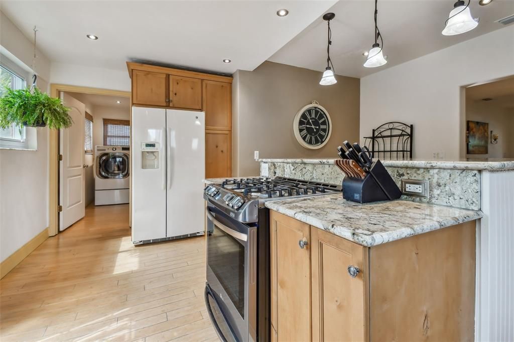 Gas range and plenty of counter space.  Kitchen leads to a huge laundry room. Convenience!