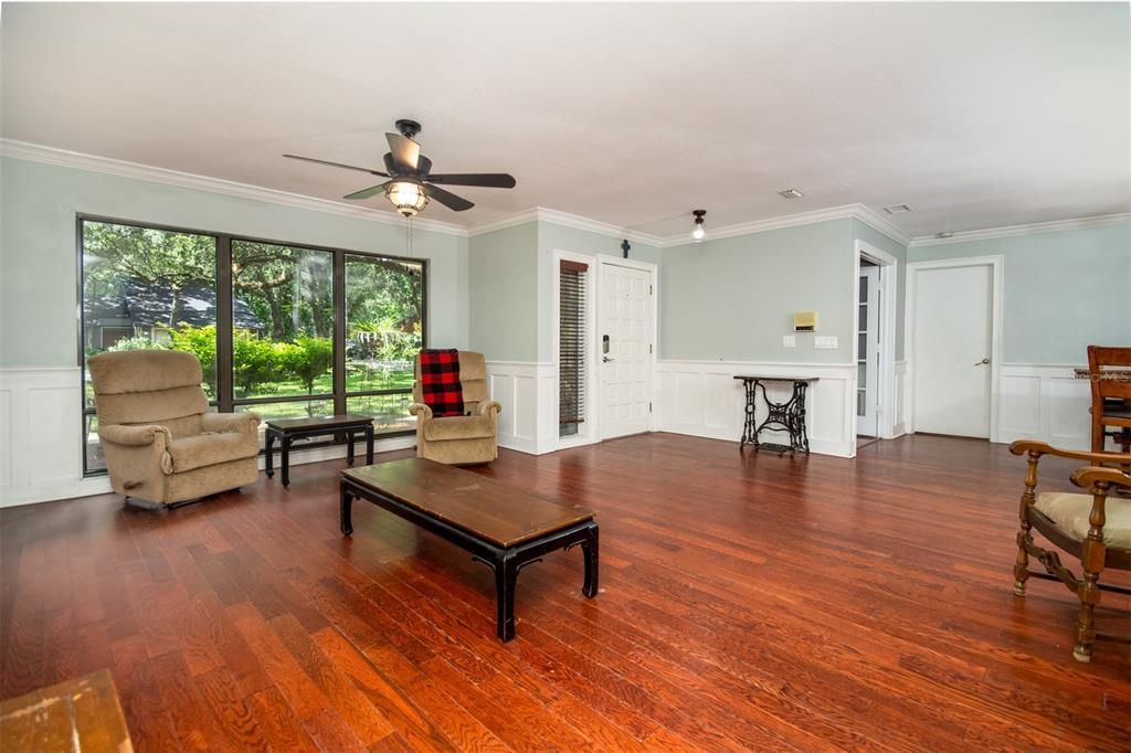 Another view of front room showing hard wood floors.