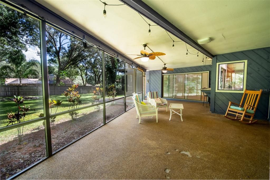 Back Porch looking out to Large Fenced in Back Yard