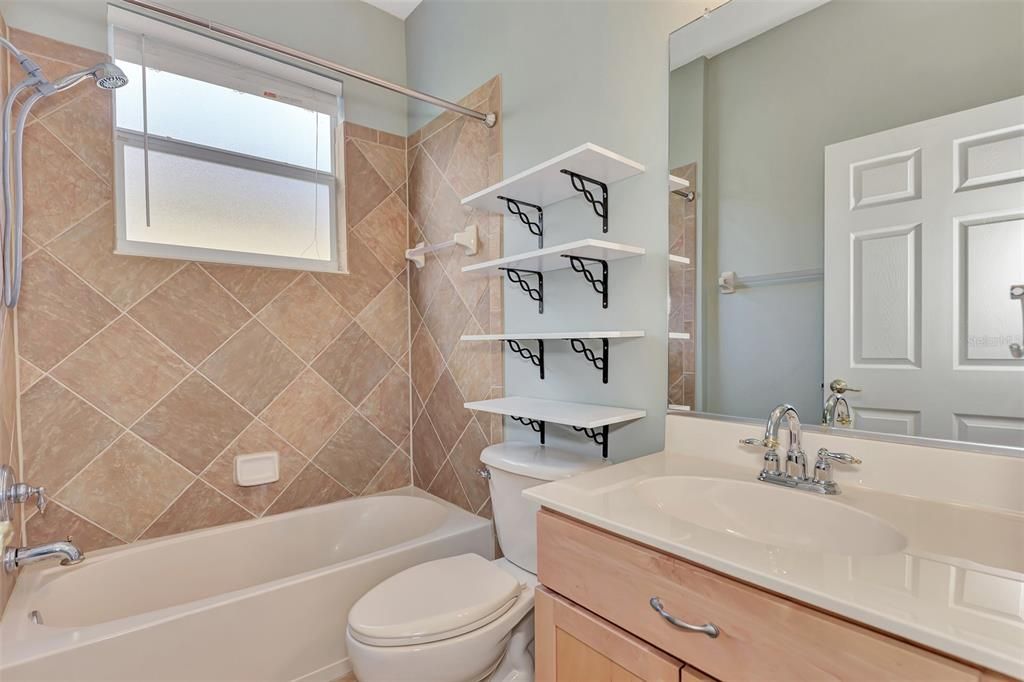 Hallway bath next to third bedroom.