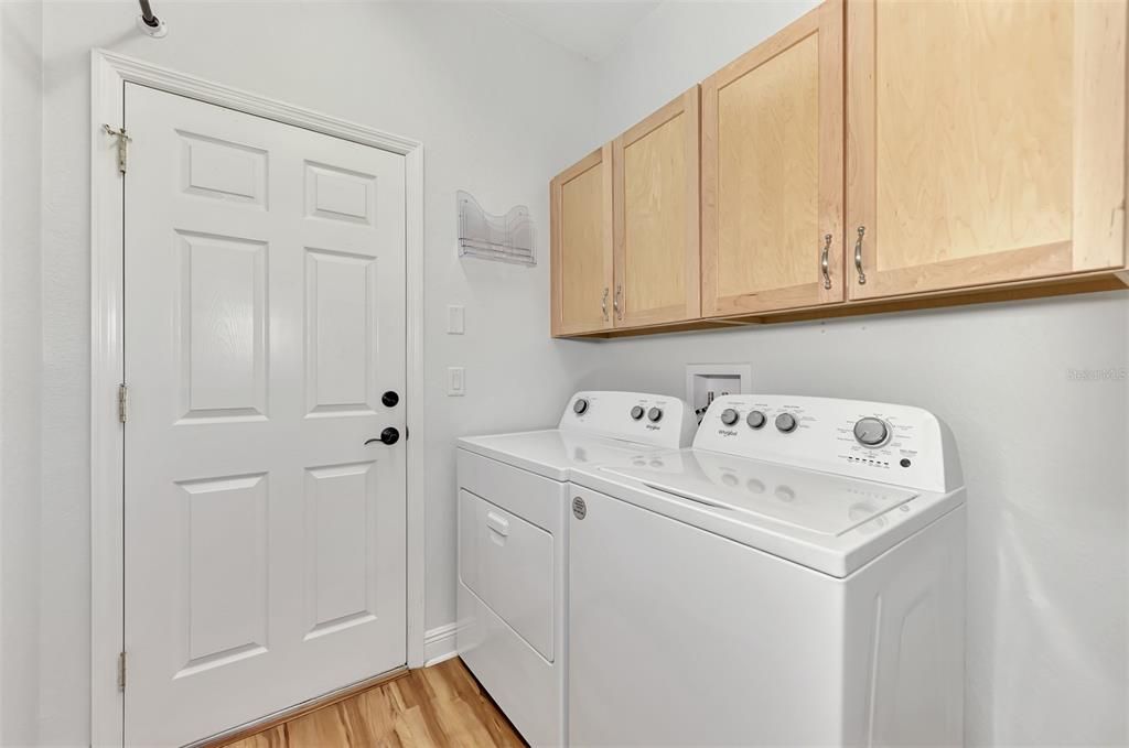 Interior laundry (BRAND NEW W/D) with additional storage and hanging space.