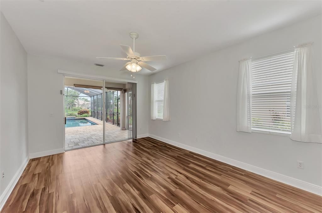 Main bedroom with pool and covered lanai entrance.