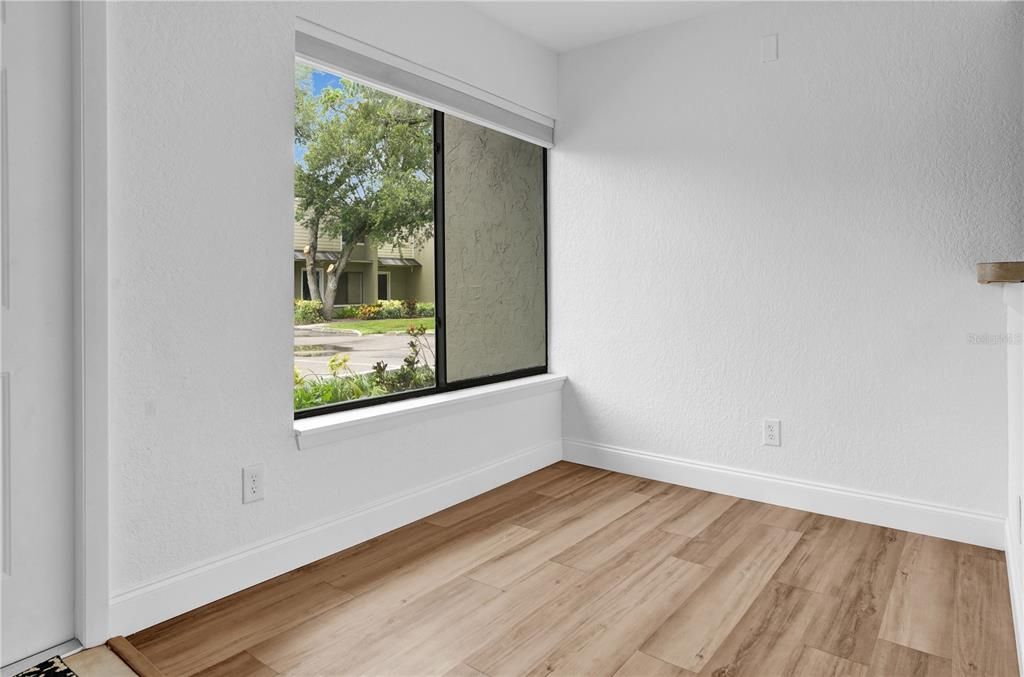 Dining Room w/ Vinyl Flooring and Built in Shades