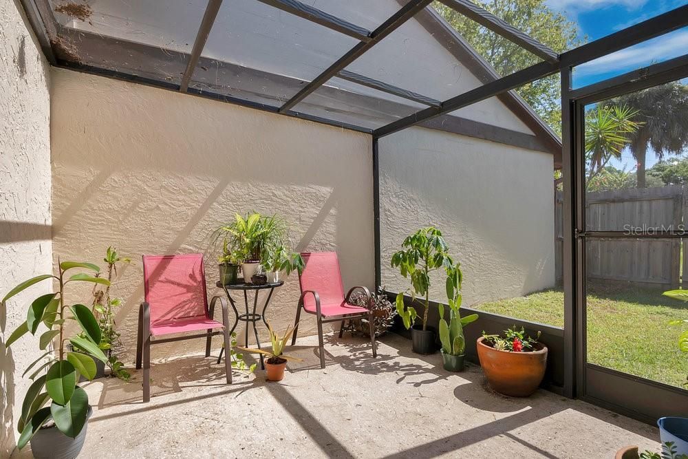 Screened in patio/porch leading to back yard