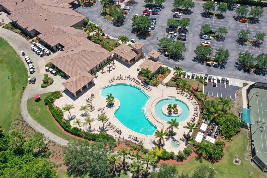 Aerial of Community pool with lazy river or resistance pool.