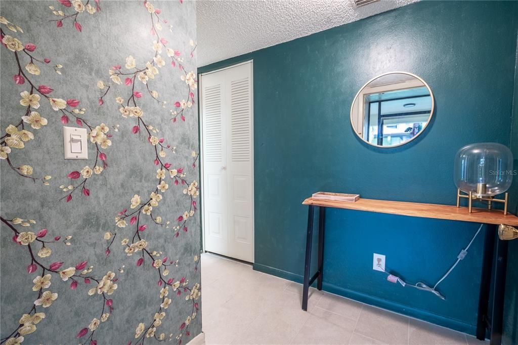 Welcoming foyer with storage closet.