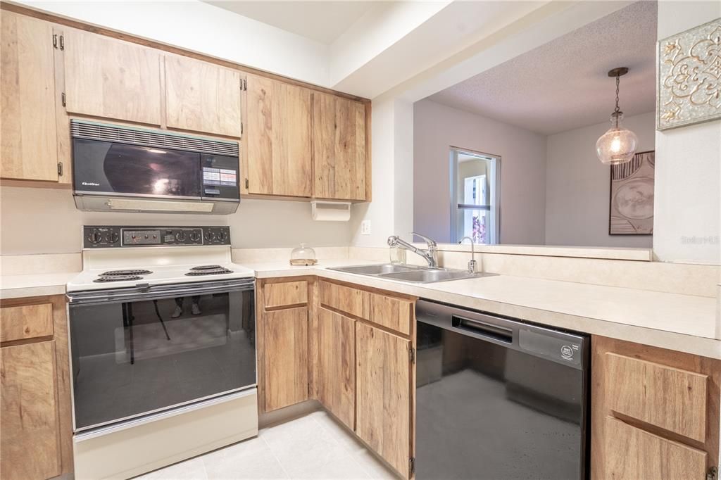 The kitchen features a breakfast counter.