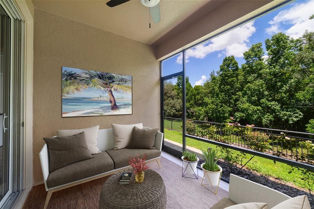 Virtually Staged: Covered screened lanai with wooded view