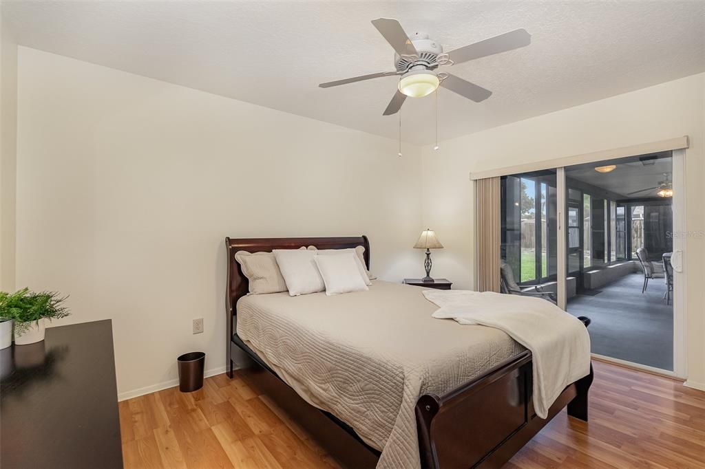 Guest bedroom with patio impact slider.