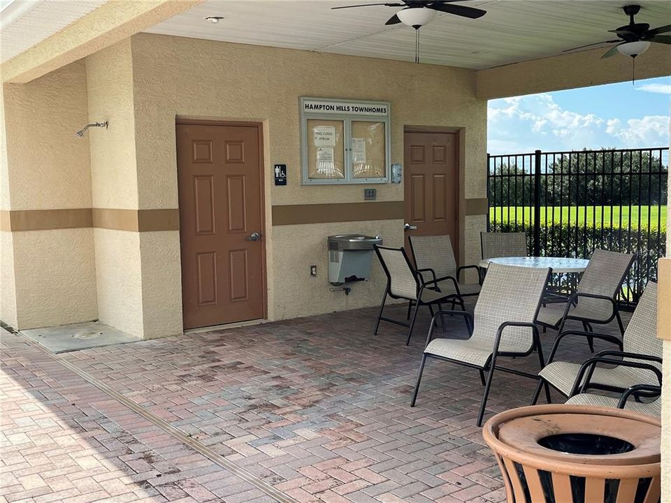 Covered area and bathrooms by pool