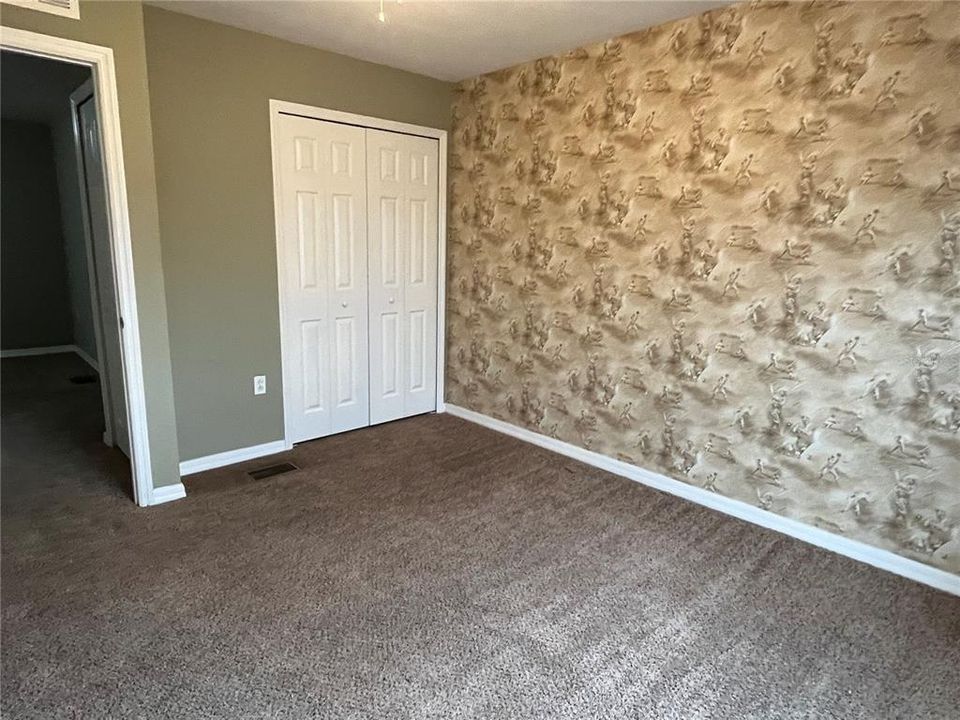 Bedroom 2 with Baseball Wallpaper on 2 walls